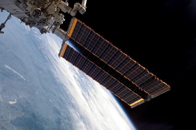NASA image: Deployment of the P4 Truss FWD SAW during Expedition 13 and STS-115 EVA Joint Operations