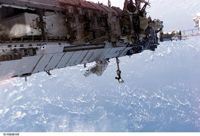 NASA image: STS-115 MS Stefanyshyn-Piper releases PVR cinches and winch PIP pins on the P3/P4 Truss during EVA