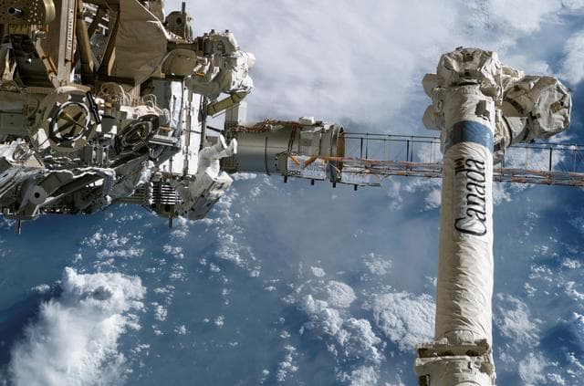 NASA image: STS-115 MS Stefanyshyn-Piper releases PVR cinches and winch PIP pins on the P3/P4 Truss during EVA