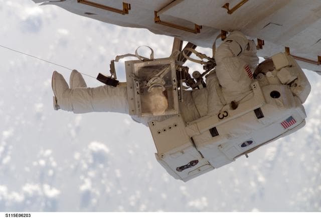 NASA image: STS-115 MS Stefanyshyn-Piper works on the P3/P4 Trusses during third EVA