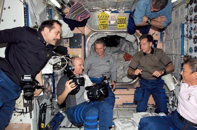 NASA image: STS-115 and Expedition 13 crewmembers in the Node 1 during Joint Operations
