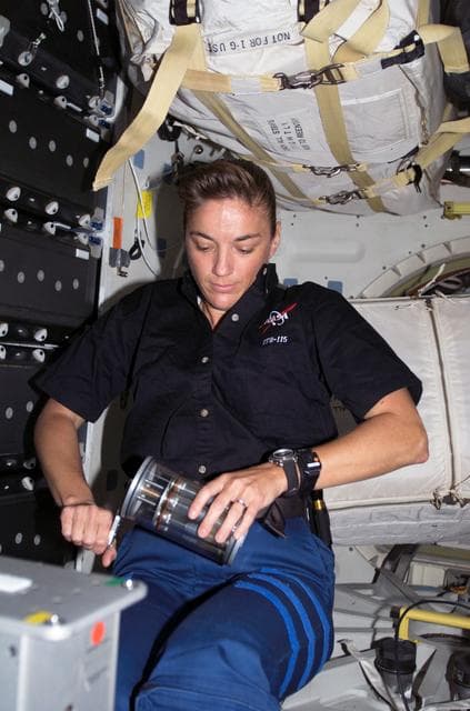 NASA image: STS-115 MS MacLean holds Yeast GAP in the FWD MDDK of the Space Shuttle Atlantis during Joint Operations