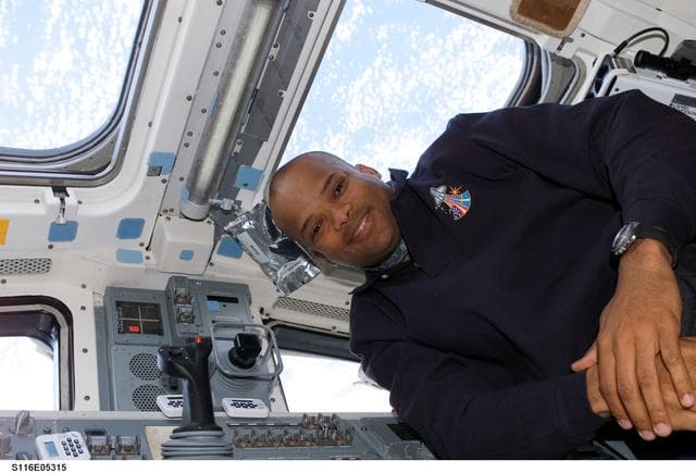 NASA image: STS-116 MS Curbeam poses in the aft FD on Space Shuttle Discovery
