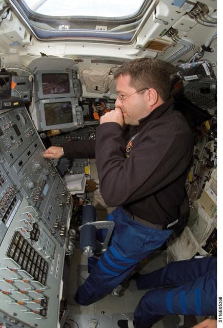 NASA image: STS-116 MS Patrick works at control panel in the aft FD on Space Shuttle Discovery
