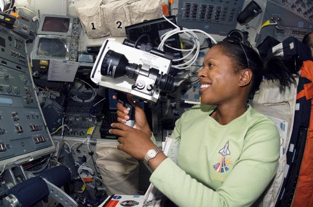 NASA image: STS-116 MS Higginbotham uses Night Scope Assembly in the aft FD on Space Shuttle Discovery