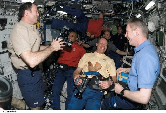 NASA image: STS-116 Crewmembers in the U.S. Laboratory during Joint Operations