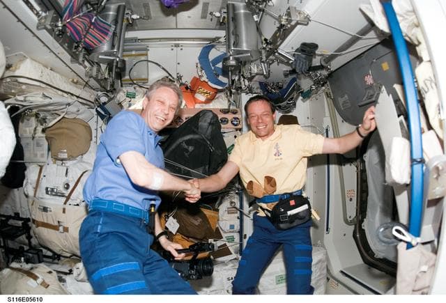 NASA image: Crewmembers Reiter and Fuglesang in the U.S. Laboratory during Joint Operations