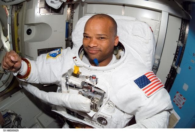 STS-116 MS Curbeam wearing EMU in the A/L after EVA 1