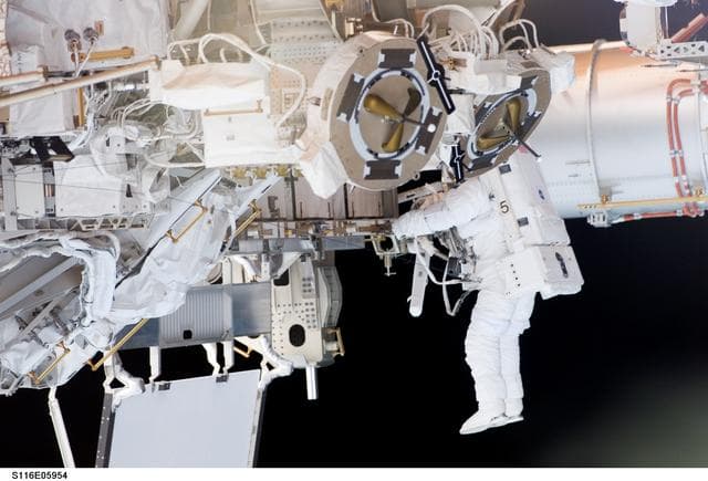 NASA image: STS-116 MS Fuglesang works at the P3/P4 Truss during EVA 1