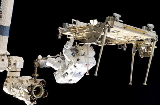 NASA image: STS-116 MS Fuglesang relocates CETA 2 cart on EVA 2