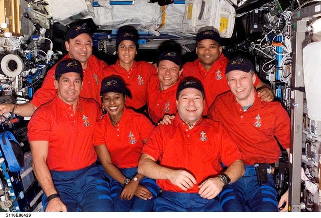 NASA image: STS-116 Crewmembers and Expedition 14 Crewmember posing in the U.S. Laboratory