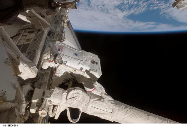 NASA image: STS-116 MS Curbeam rewires during EVA 3