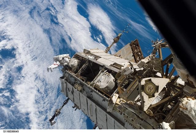 NASA image: STS-116 MS on S1 Truss works near DDCU on Bay 15 during EVA 3