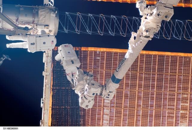 NASA image: STS-116 MS Fuglesang and Curbeam during EVA-4