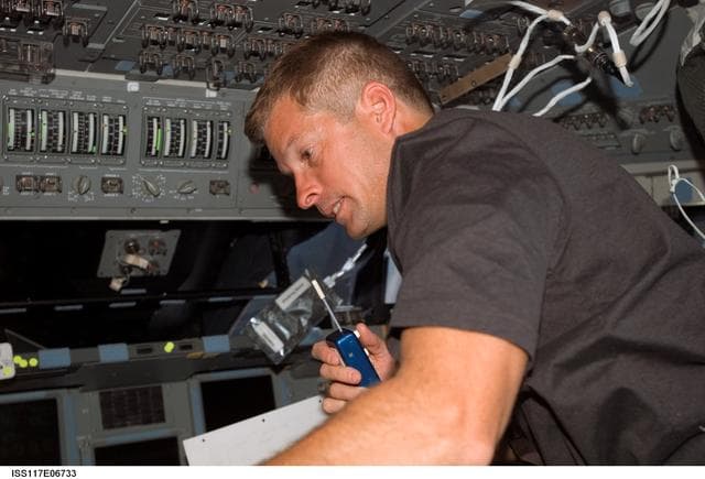 NASA image: Swanson uses communication equipment in the FD of STS-117 Space Shuttle Atlantis
