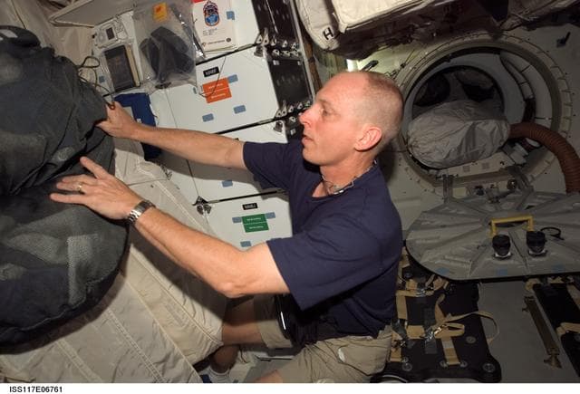 NASA image: Reilly works with CTB in the FWD MDDK of STS-117 Space Shuttle Atlantis