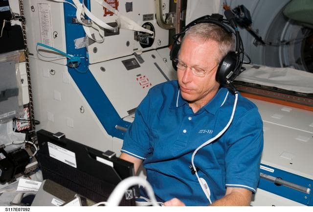 NASA image: Forrester works with the TRAC Experiment in the U.S Laboratory during Joint Operations