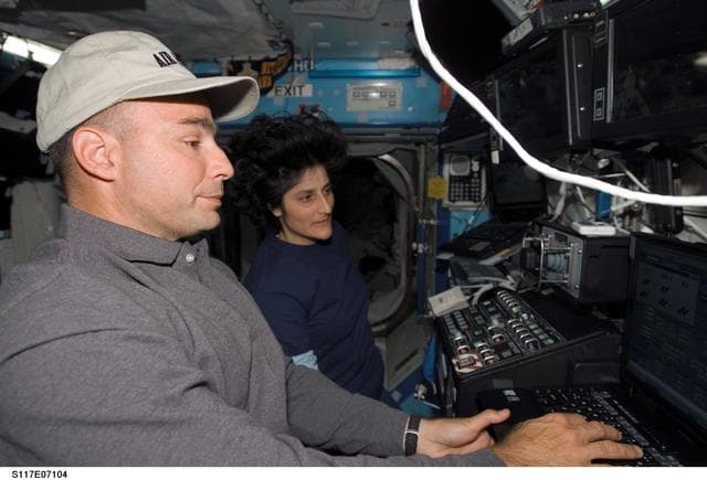 NASA image: Archambault and Williams work controls of the SSRMS during Joint Operations