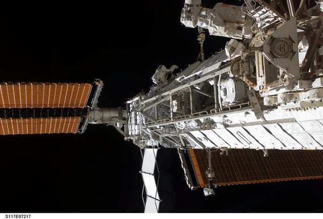 NASA image: Forrester works on the S1/S3 Trusses during EVA 2 on STS-117 Mission