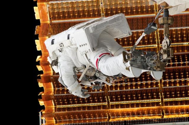 NASA image: Forrester prepares to retract the P6 Truss STBD SAW during EVA 2