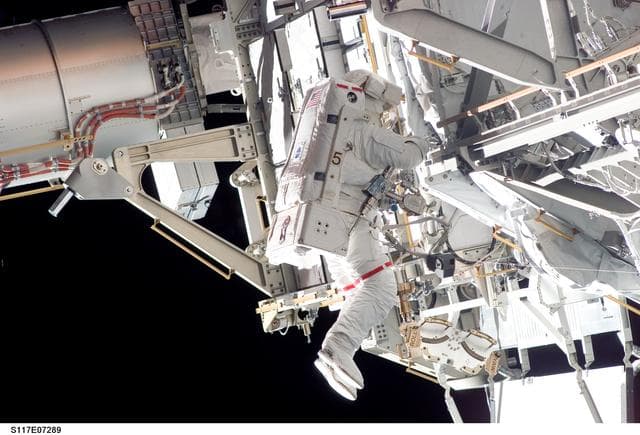 NASA image: Forrester works at the S3/S4 Trusses during EVA 2 on STS-117 Mission