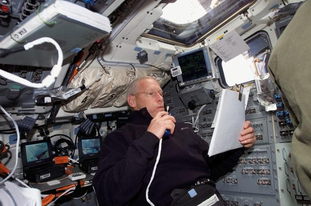 NASA image: Forrester uses communication equipment in the aft FD window on STS-117 Space Shuttle Atlantis