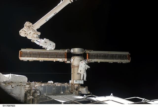 NASA image: Reilly and Olivas try to retract the final bay of the P6 Truss STBD 2B SAW during STS-117 EVA 3