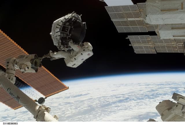 NASA image: View of MS Williams transporting the new CMG during EVA 2
