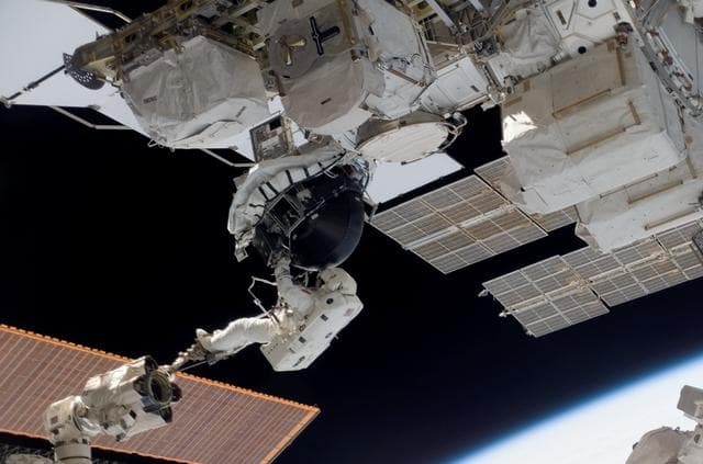 NASA image: View of MS Williams transporting the new CMG during EVA 2
