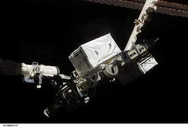 NASA image: View of the ESP 3 as its being transferred to the P3 Truss for Installation