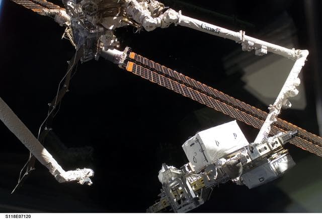 NASA image: View of the ESP 3 as its being transferred to the P3 Truss for Installation