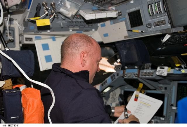 NASA image: View of Kelly working in the FD during STS-118/Expedition 15 Joint Operations
