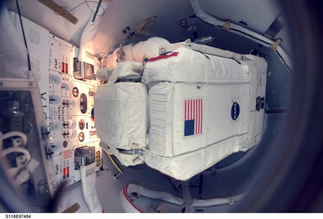 NASA image: Mastracchio in the crew lock before a session of STS-118 EVA