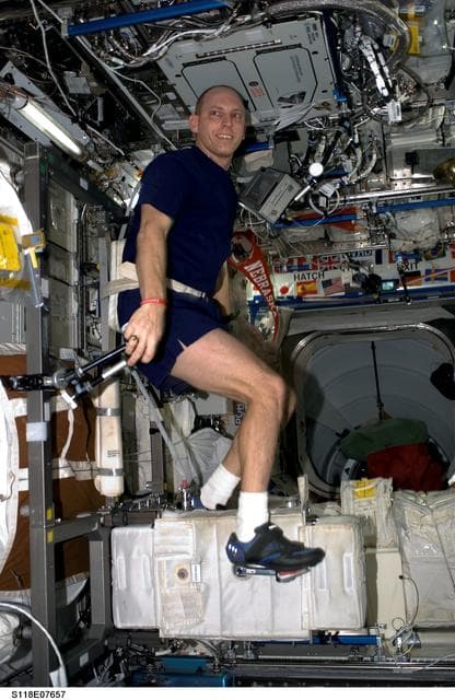 NASA image: FE Anderson exercising on the CEVIS during STS-118/Expedition 15 Joint Operations