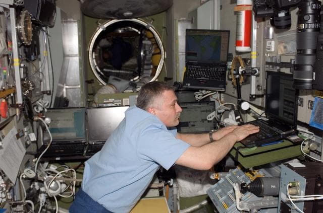 NASA image: View of Yurchikhin working in the SM during STS-118/Expedition 15 Joint Operations