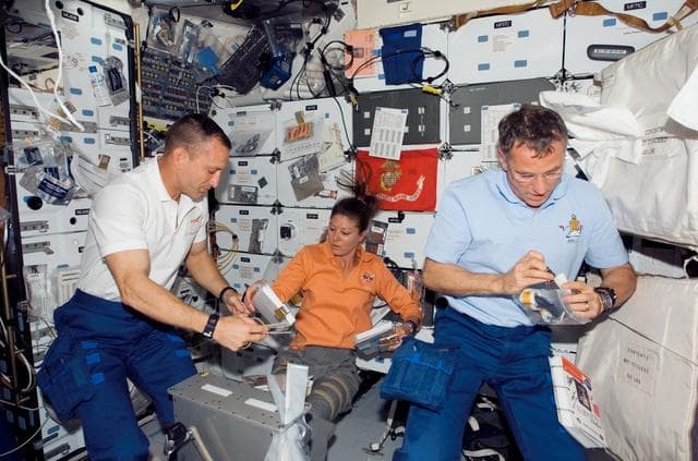 NASA image: View of Crewmembers in the MDDK of the Shuttle Endeavour during STS-118