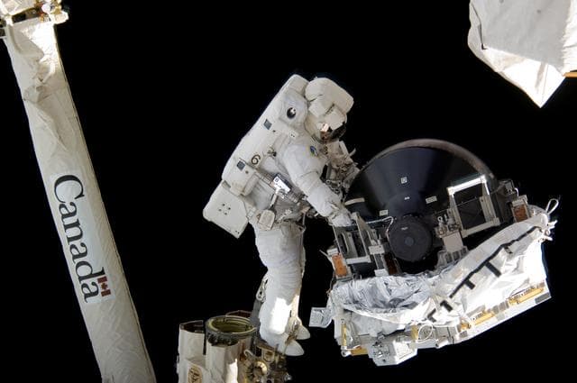 NASA image: View of MS Williams transporting the new CMG to the ESP2 during EVA 2