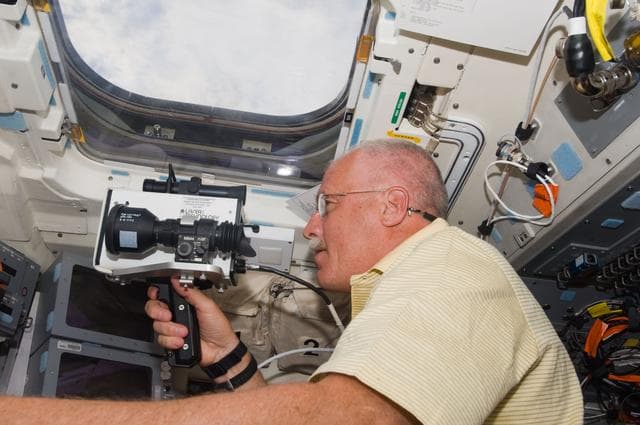 NASA image: Phillips with Camera on the Flight Deck (FD)