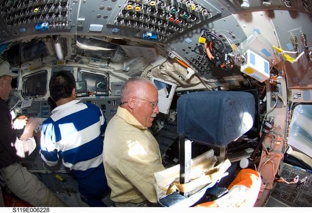 NASA image: Archambault, Wakata and Phillips on AFT Flight Deck (FD)