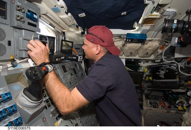 NASA image: Antonelli uses remote manipulator system (RMS) at AFT Flight Deck (FD)