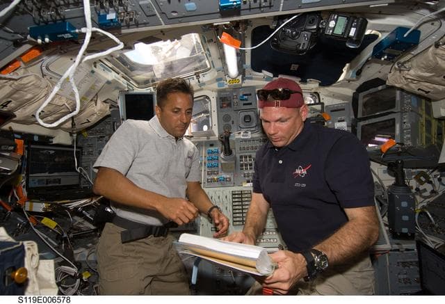 NASA image: Acaba and Antonelli during remote manipulator system (RMS) OPS at AFT Flight Deck (FD)