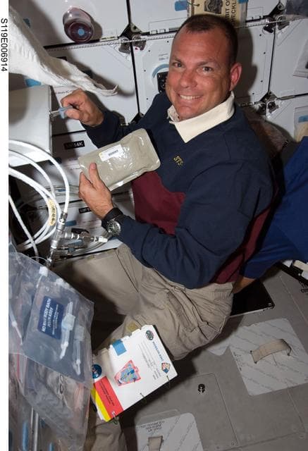 NASA image: Antonelli works with Food Stowage on Middeck (MDDK)