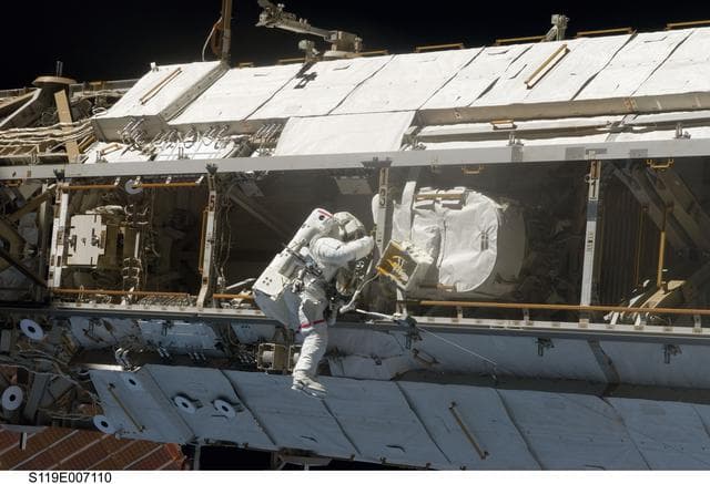 NASA image: STS-119 EVA 3 GAT S1 Truss  Flex Hose Rotary Coupler (FHRC) P-Clamp Release