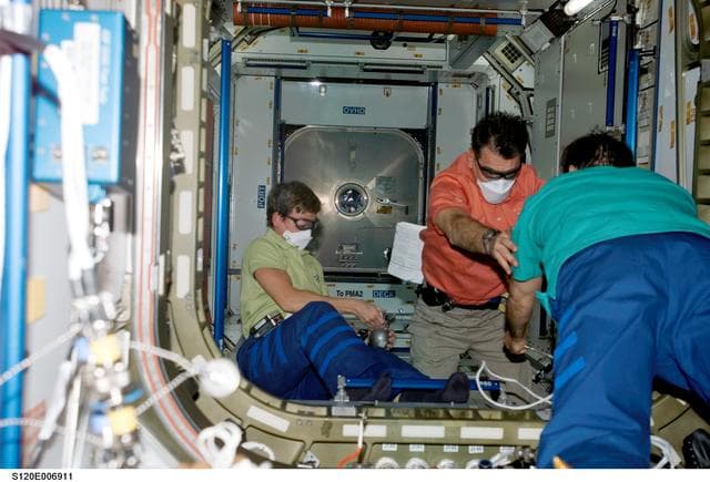NASA image: Whitson, Malenchenko and Nespoli  work in Node 2