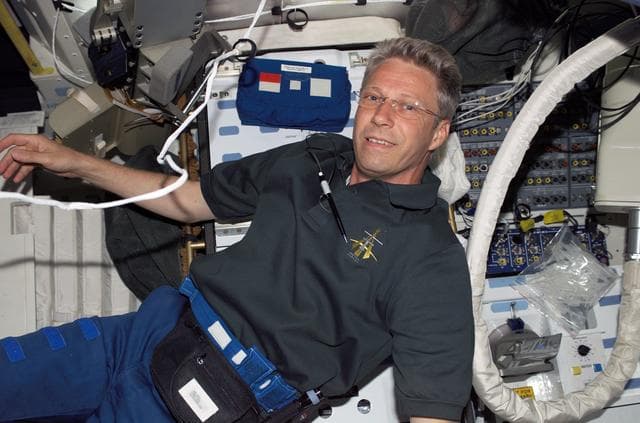 NASA image: Reiter smiles at camera in the MDK during STS-121