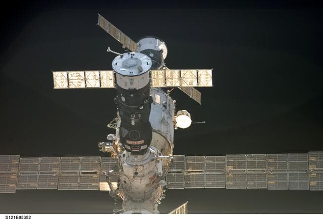 NASA image: Soyuz,FGB and the SM as Discovery approaches for docking during STS-121