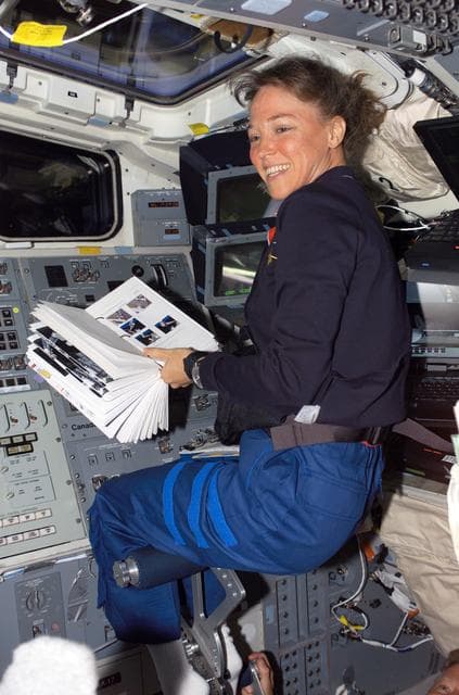 NASA image: Nowak reads a checklist during OBSS berthing operations on STS-121