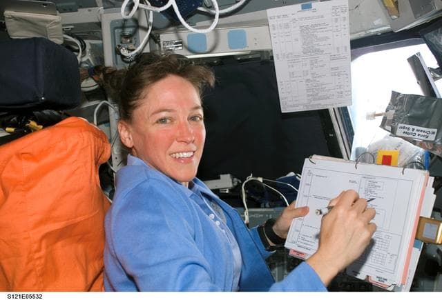 NASA image: Nowak with timeline on the orbiter FD during STS-121