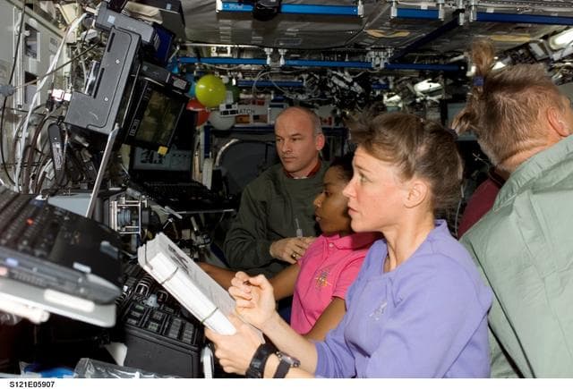 NASA image: Nowak and Wilson work at the SSRMS during STS-121/Exp. 13 OPS