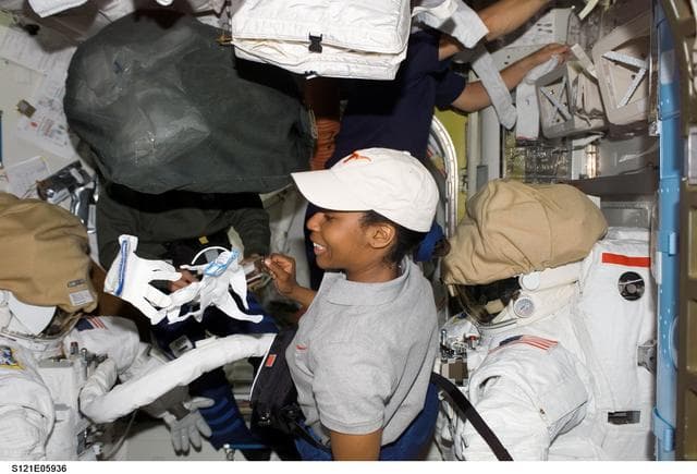 NASA image: Sellers and Wilson inside the A/L during STS-121/ Exp. 13 joint OPS